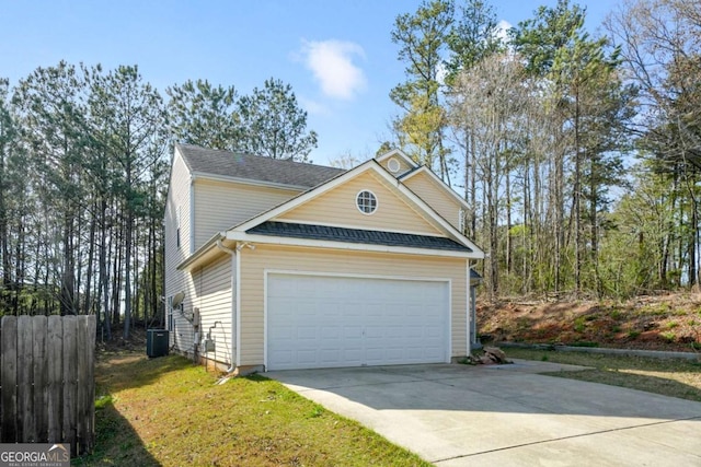 view of front of home with driveway, cooling unit, a garage, fence, and a shingled roof