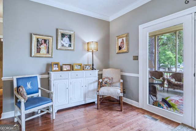 126 N Valhalla Ct, Cordele, GA 31015 - sitting room with crown molding, light wood-type flooring, and baseboards