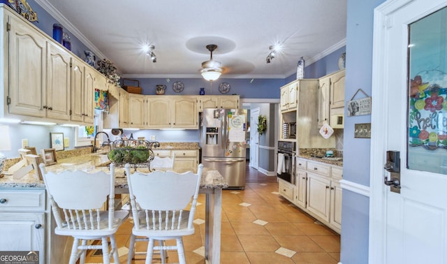 126 N Valhalla Ct, Cordele, GA 31015 - kitchen featuring appliances with stainless steel finishes, light stone countertops, ornamental molding, a peninsula, and light tile patterned flooring