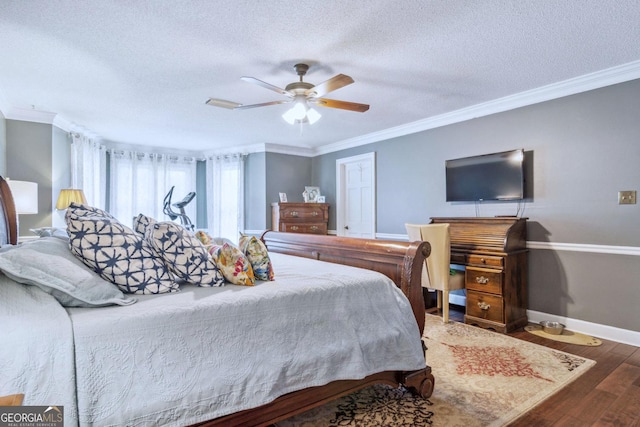 126 N Valhalla Ct, Cordele, GA 31015 - bedroom featuring wood finished floors, a textured ceiling, baseboards, ornamental molding, and a ceiling fan