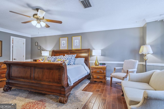 126 N Valhalla Ct, Cordele, GA 31015 - bedroom with dark wood-style flooring, crown molding, and a ceiling fan