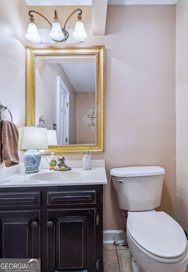 126 N Valhalla Ct, Cordele, GA 31015 - bathroom featuring toilet, baseboards, vanity, and tile patterned flooring