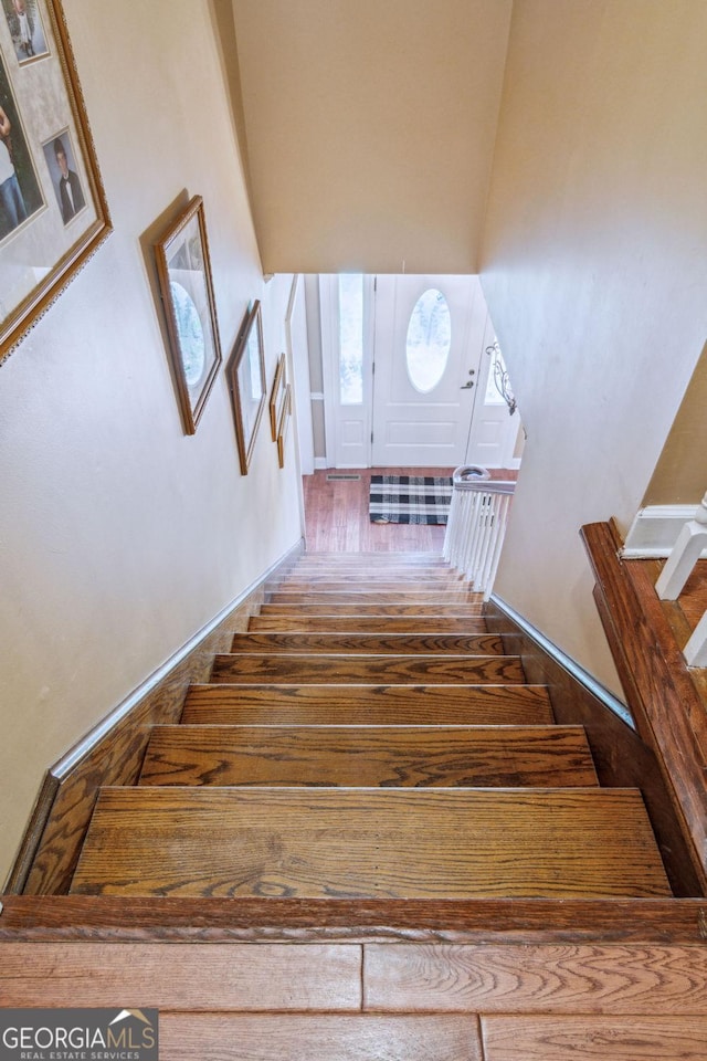 126 N Valhalla Ct, Cordele, GA 31015 - stairs with wood finished floors and baseboards