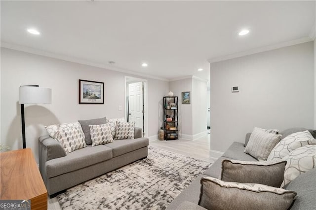 living room with baseboards, recessed lighting, light wood-type flooring, and ornamental molding