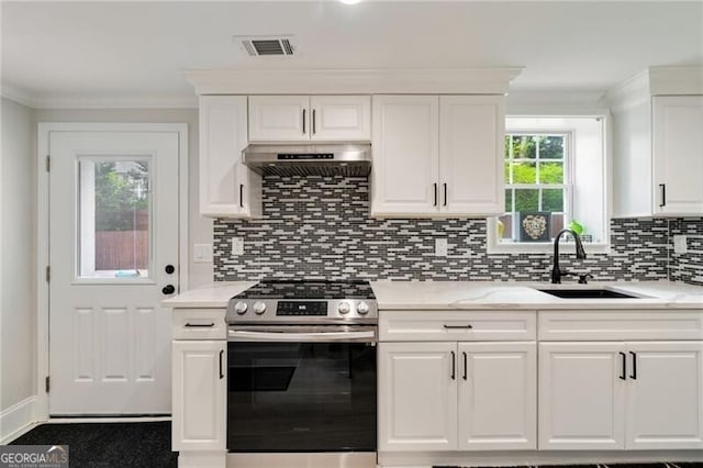 kitchen featuring visible vents, a sink, stainless steel gas range, under cabinet range hood, and crown molding