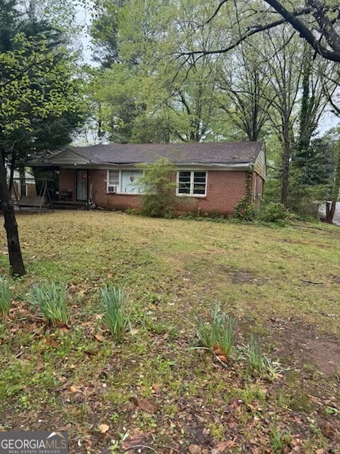 2667 Plantation Dr, Atlanta, GA 30344 - view of front facade featuring a front yard and brick siding
