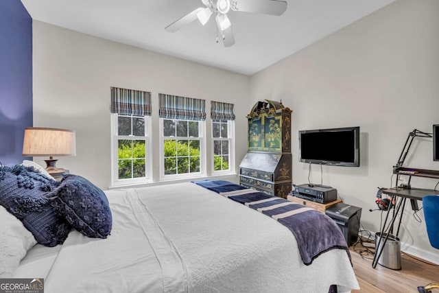bedroom featuring wood finished floors and ceiling fan