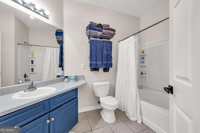 bathroom with vanity, tile patterned flooring, toilet, shower / tub combo with curtain, and baseboards