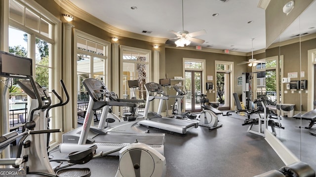 gym featuring ceiling fan, ornamental molding, visible vents, and a wealth of natural light