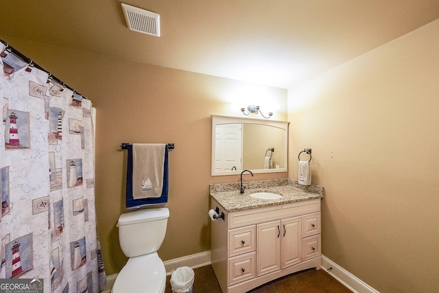 31 Vine Creek Ln, Acworth, GA 30101 - bathroom with baseboards, toilet, vanity, and curtained shower
