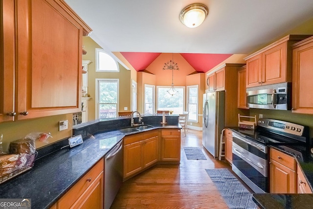 31 Vine Creek Ln, Acworth, GA 30101 - kitchen featuring stainless steel appliances, a sink, wood finished floors, a peninsula, and decorative light fixtures