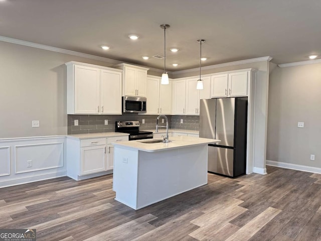 kitchen featuring a sink, light countertops, white cabinetry, and stainless steel appliances