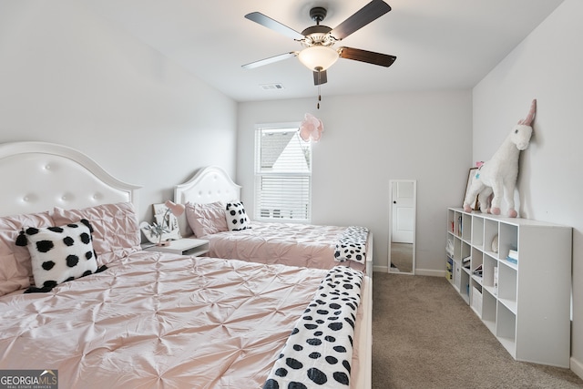 bedroom with visible vents, baseboards, ceiling fan, and carpet floors