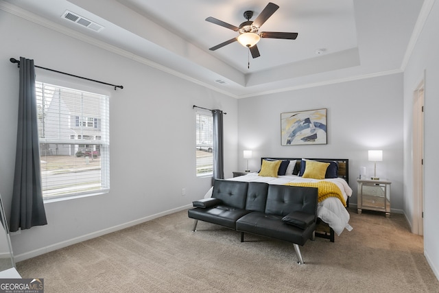 bedroom featuring a raised ceiling, baseboards, visible vents, and carpet floors
