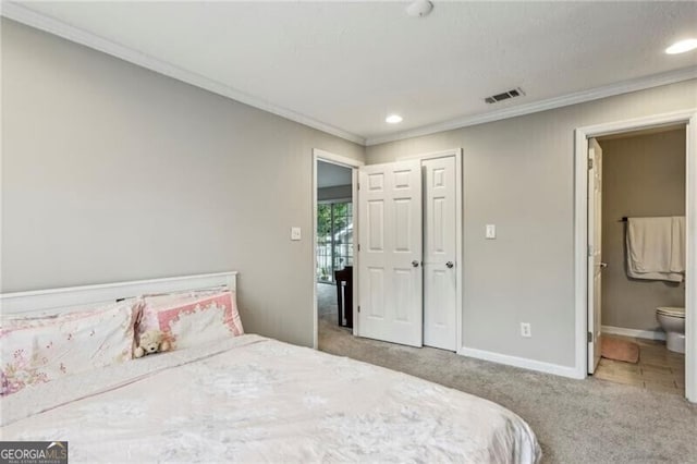 carpeted bedroom featuring crown molding, connected bathroom, visible vents, recessed lighting, and baseboards