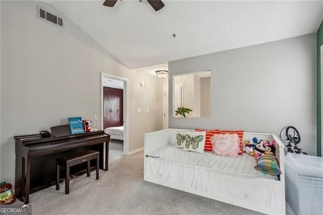 carpeted living room with ceiling fan with notable chandelier, visible vents, and lofted ceiling