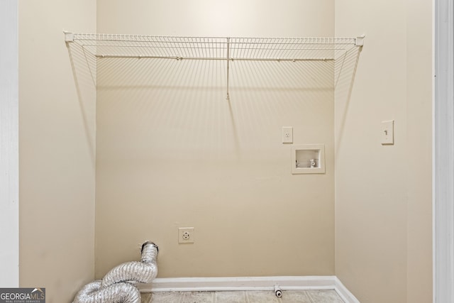 1016 Borrington Ln, Stockbridge, GA 30281 - washroom featuring electric dryer hookup, washer hookup, and tile patterned floors