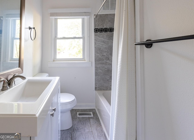 bathroom with marble finish floor, visible vents, toilet, vanity, and shower / bath combo with shower curtain
