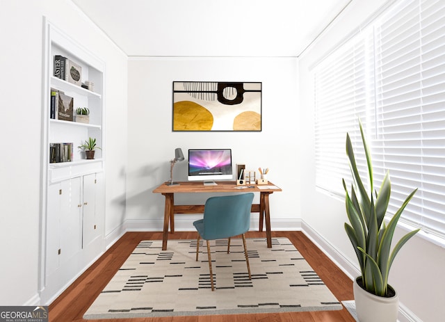 office with wood finished floors and baseboards