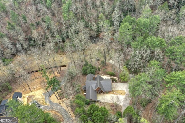 drone / aerial view featuring a forest view
