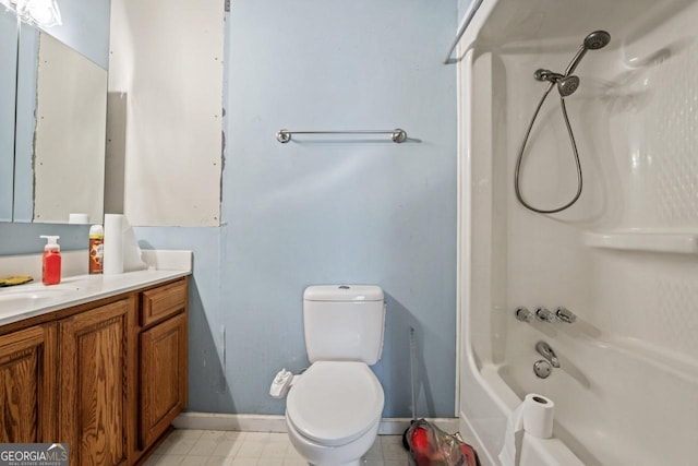 full bath featuring vanity, baseboards, toilet, and shower / washtub combination
