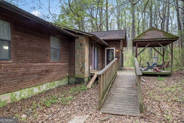 view of side of property featuring stone siding
