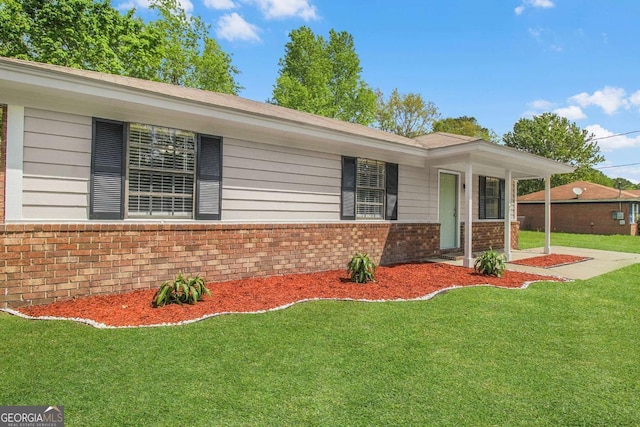 197 Sequoia Cir, Hinesville, GA 31313 - ranch-style house with brick siding and a front lawn