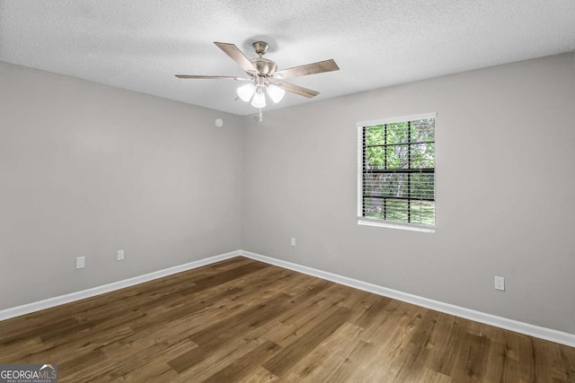 197 Sequoia Cir, Hinesville, GA 31313 - empty room with wood finished floors, a ceiling fan, and a textured ceiling