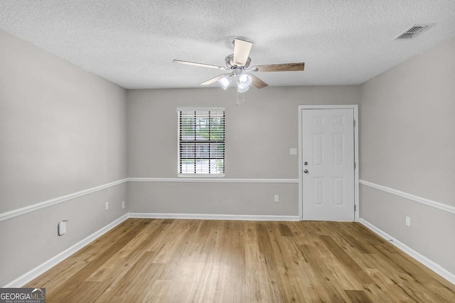 197 Sequoia Cir, Hinesville, GA 31313 - unfurnished room with light wood-type flooring, a textured ceiling, and a ceiling fan