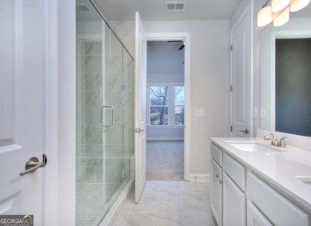 bathroom with a shower stall, double vanity, visible vents, and a sink