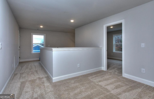 unfurnished room featuring baseboards, recessed lighting, and carpet flooring
