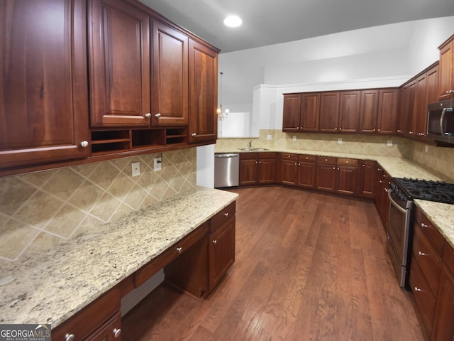 409 Kenley Ct, Mcdonough, GA 30253 - kitchen with appliances with stainless steel finishes, light stone countertops, dark wood-style floors, and decorative backsplash