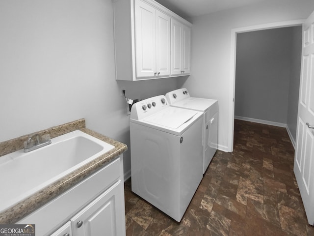 409 Kenley Ct, Mcdonough, GA 30253 - laundry room featuring cabinet space, washing machine and clothes dryer, and stone finish floors