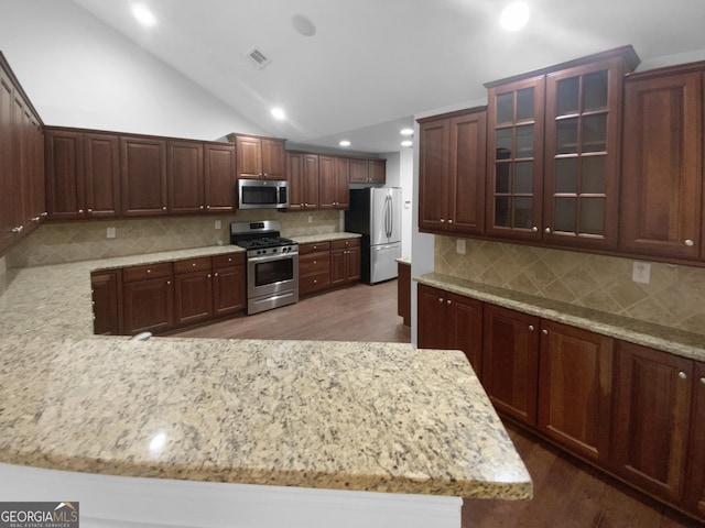 409 Kenley Ct, Mcdonough, GA 30253 - kitchen featuring stainless steel appliances, wood finished floors, recessed lighting, decorative backsplash, and light stone countertops