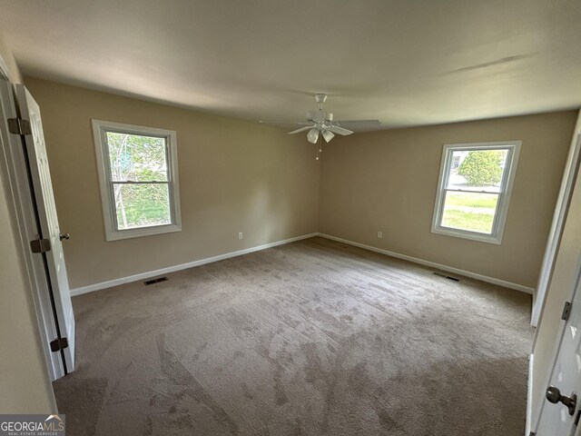 219 Hammerhawk Rd, Griffin, GA 30223 - unfurnished bedroom featuring carpet, visible vents, and baseboards