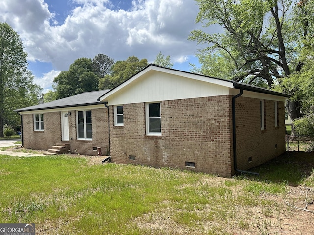 219 Hammerhawk Rd, Griffin, GA 30223 - view of side of home featuring brick siding, a yard, and crawl space
