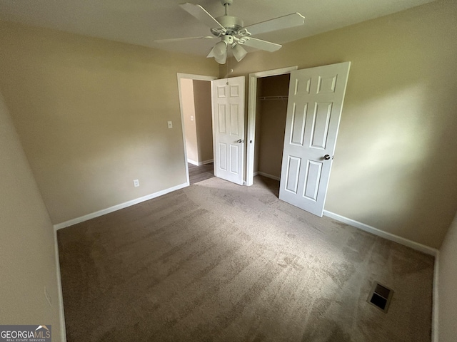 219 Hammerhawk Rd, Griffin, GA 30223 - unfurnished bedroom featuring visible vents, baseboards, a closet, ceiling fan, and carpet floors