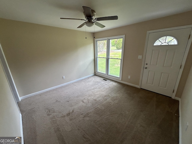 219 Hammerhawk Rd, Griffin, GA 30223 - foyer entrance featuring carpet flooring, visible vents, baseboards, and a ceiling fan