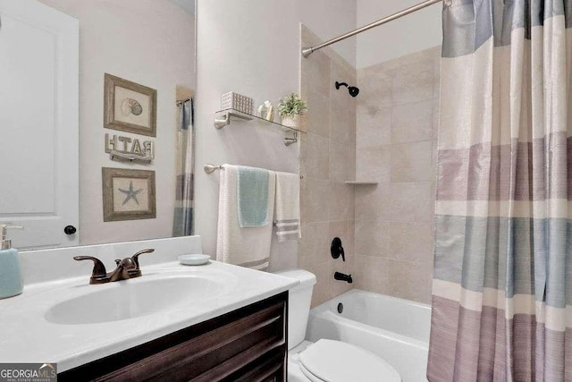 full bathroom with toilet, shower / tub combo with curtain, and vanity