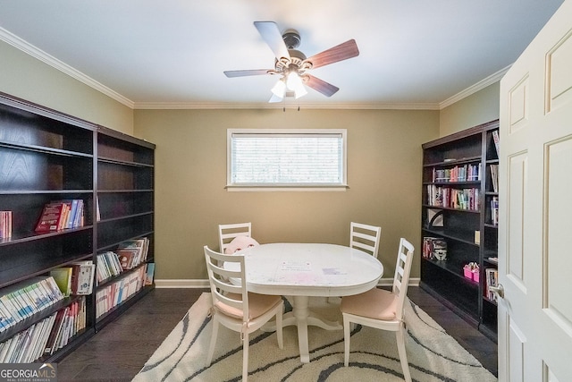 dining area with ceiling fan, dark wood-type flooring, baseboards, and ornamental molding