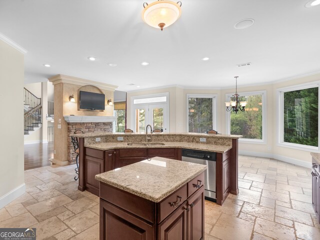 5297 Heron Bay Blvd, Locust Grove, GA 30248 - kitchen featuring a sink, stainless steel dishwasher, a center island, and stone tile floors