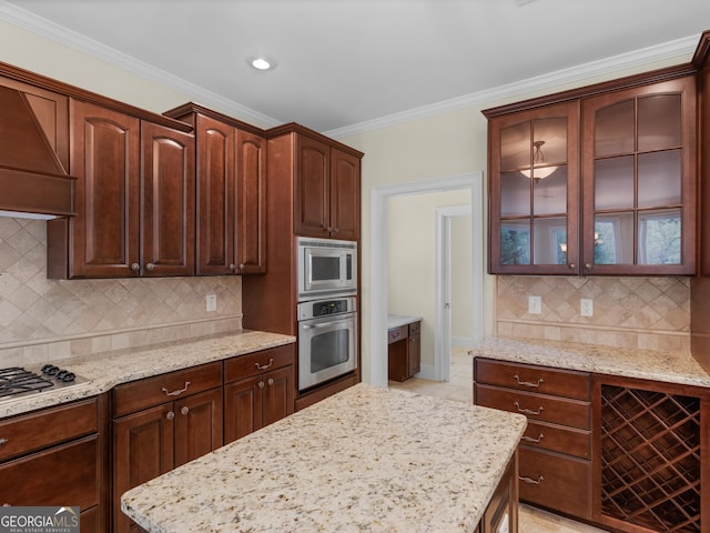 5297 Heron Bay Blvd, Locust Grove, GA 30248 - kitchen with tasteful backsplash, glass insert cabinets, wall chimney exhaust hood, appliances with stainless steel finishes, and crown molding