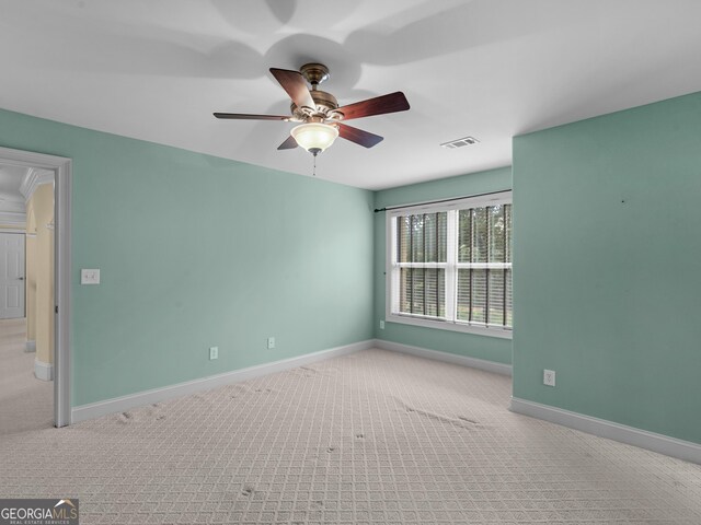 5297 Heron Bay Blvd, Locust Grove, GA 30248 - carpeted spare room featuring baseboards, a ceiling fan, and visible vents