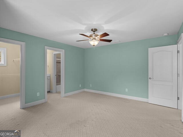 5297 Heron Bay Blvd, Locust Grove, GA 30248 - unfurnished bedroom featuring light carpet, a closet, baseboards, and a spacious closet
