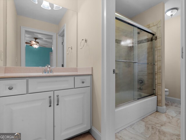 5297 Heron Bay Blvd, Locust Grove, GA 30248 - full bath with baseboards, bath / shower combo with glass door, toilet, vanity, and marble finish floor