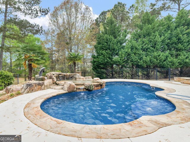 5297 Heron Bay Blvd, Locust Grove, GA 30248 - view of pool with a fenced in pool and fence