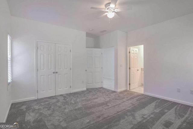 4066 Wild Orchid Ln, Loganville, GA 30052 - unfurnished bedroom featuring carpet flooring, a closet, and baseboards