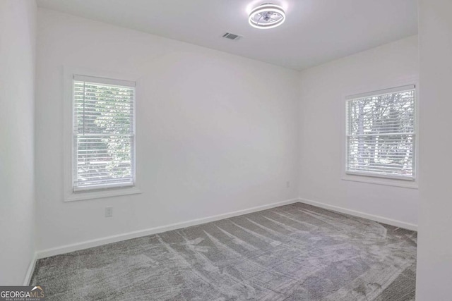 4066 Wild Orchid Ln, Loganville, GA 30052 - spare room featuring carpet, visible vents, and baseboards
