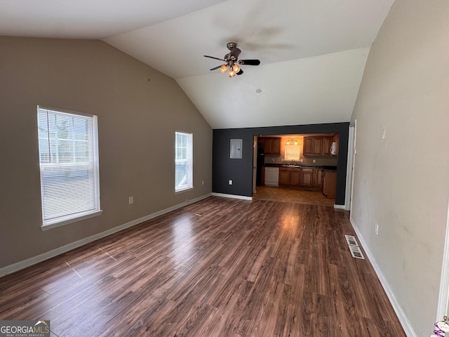 unfurnished living room with ceiling fan, vaulted ceiling, dark wood-style floors, and baseboards