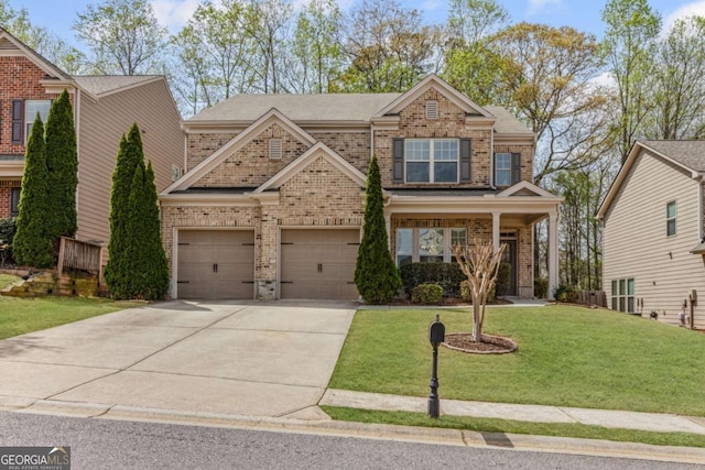 craftsman inspired home with concrete driveway, a front lawn, and brick siding